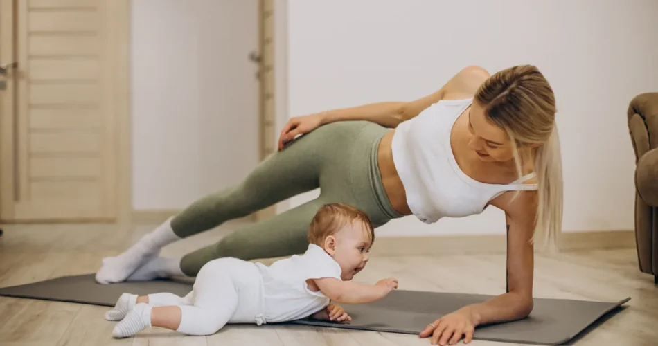 a mother in side plank next to her baby doing tummy time
